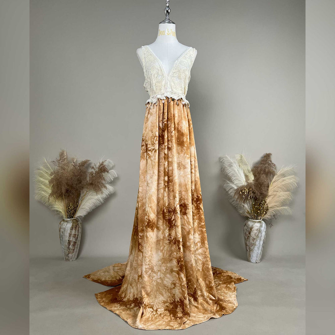 A mannequin displays an Aura tie-dye gown with a white crochet  top.