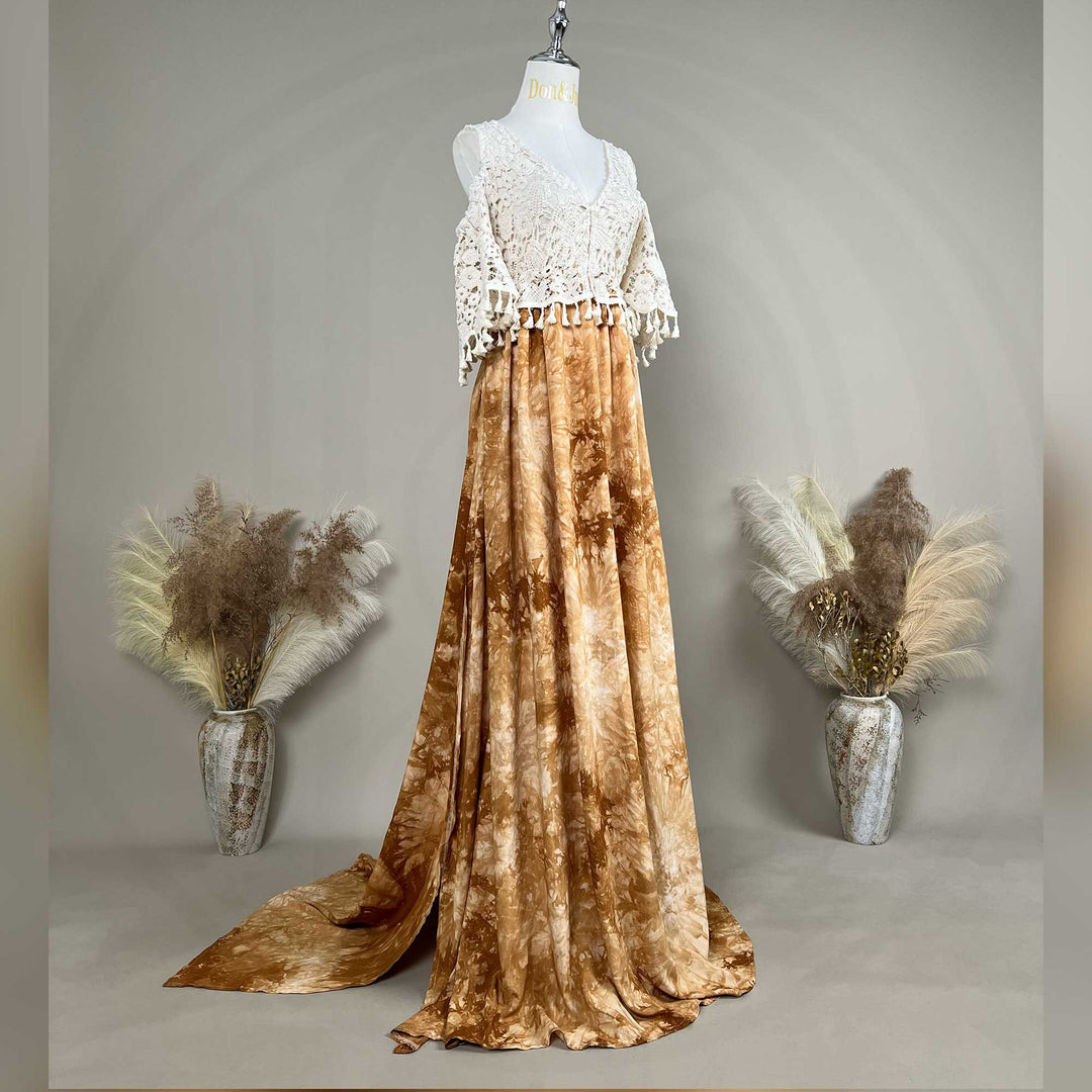 A mannequin displays an Aura white crochet top with a tie-dye skirt.