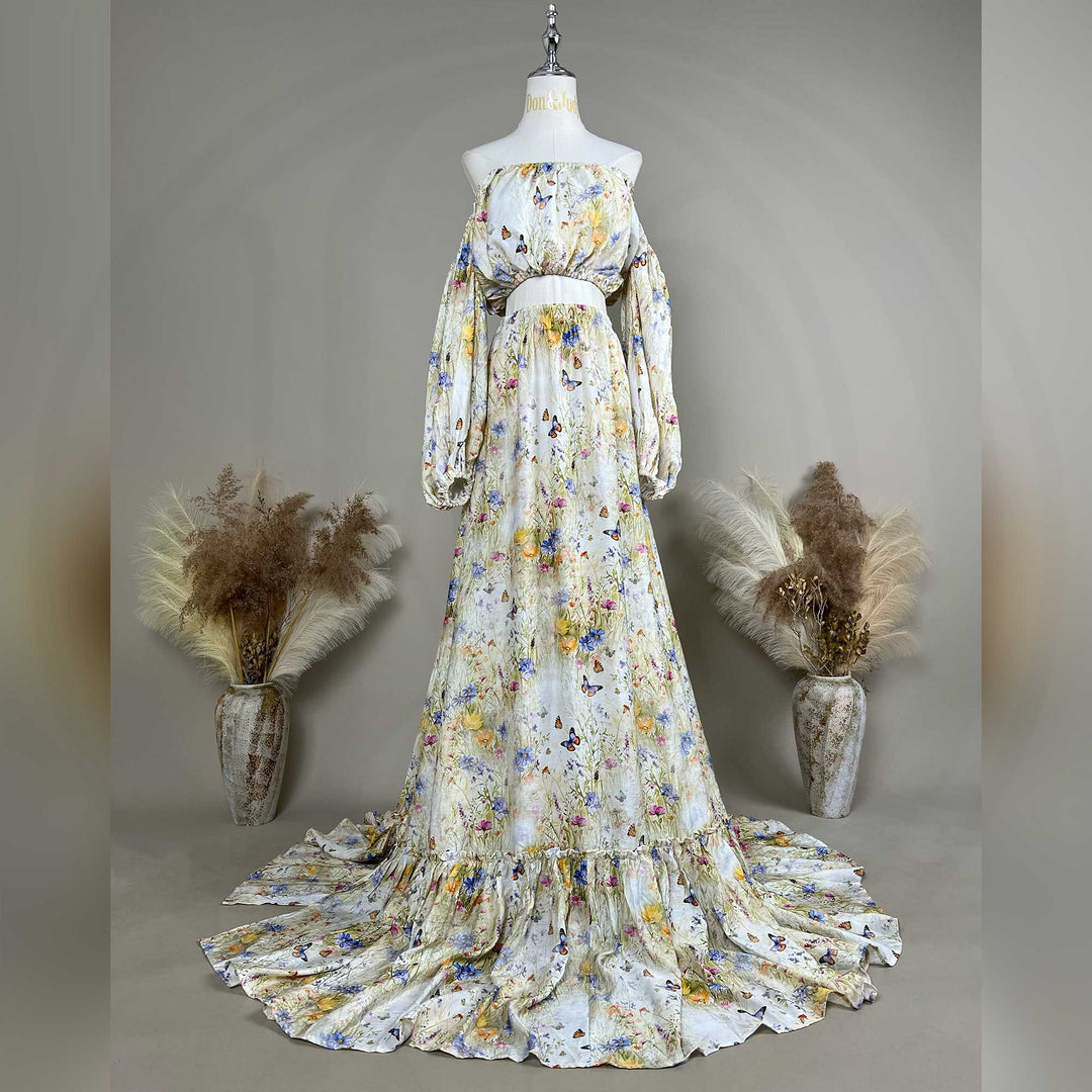 An Aurelia floral and butterfly print off-shoulder two-piece is displayed on a mannequin.
