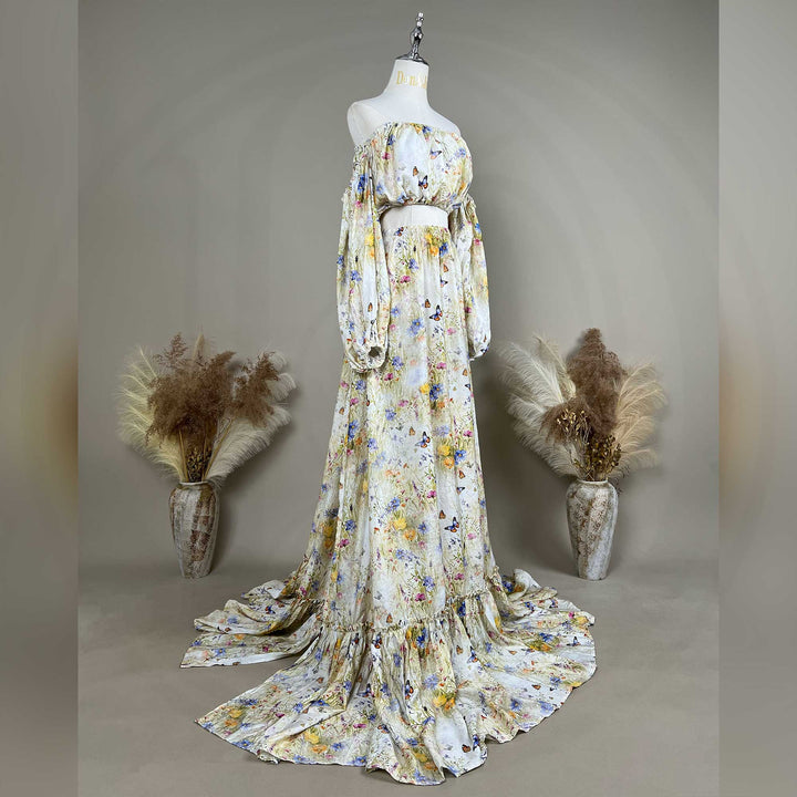 A side view of an Aurelia floral and butterfly print off-shoulder two-piece is displayed on a mannequin.