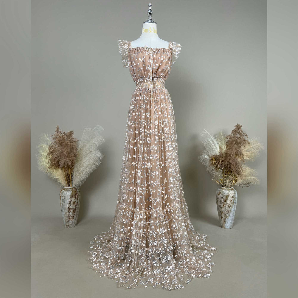 A Clete khaki floral embroidered short sleeve maternity photography dress displayed on a mannequin.