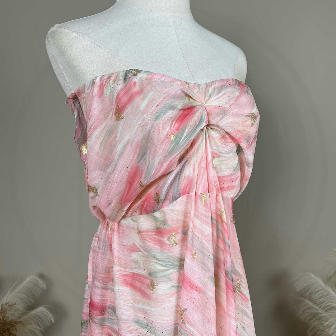 The upper body of a Cybele pink printed strapless gown with pleats.