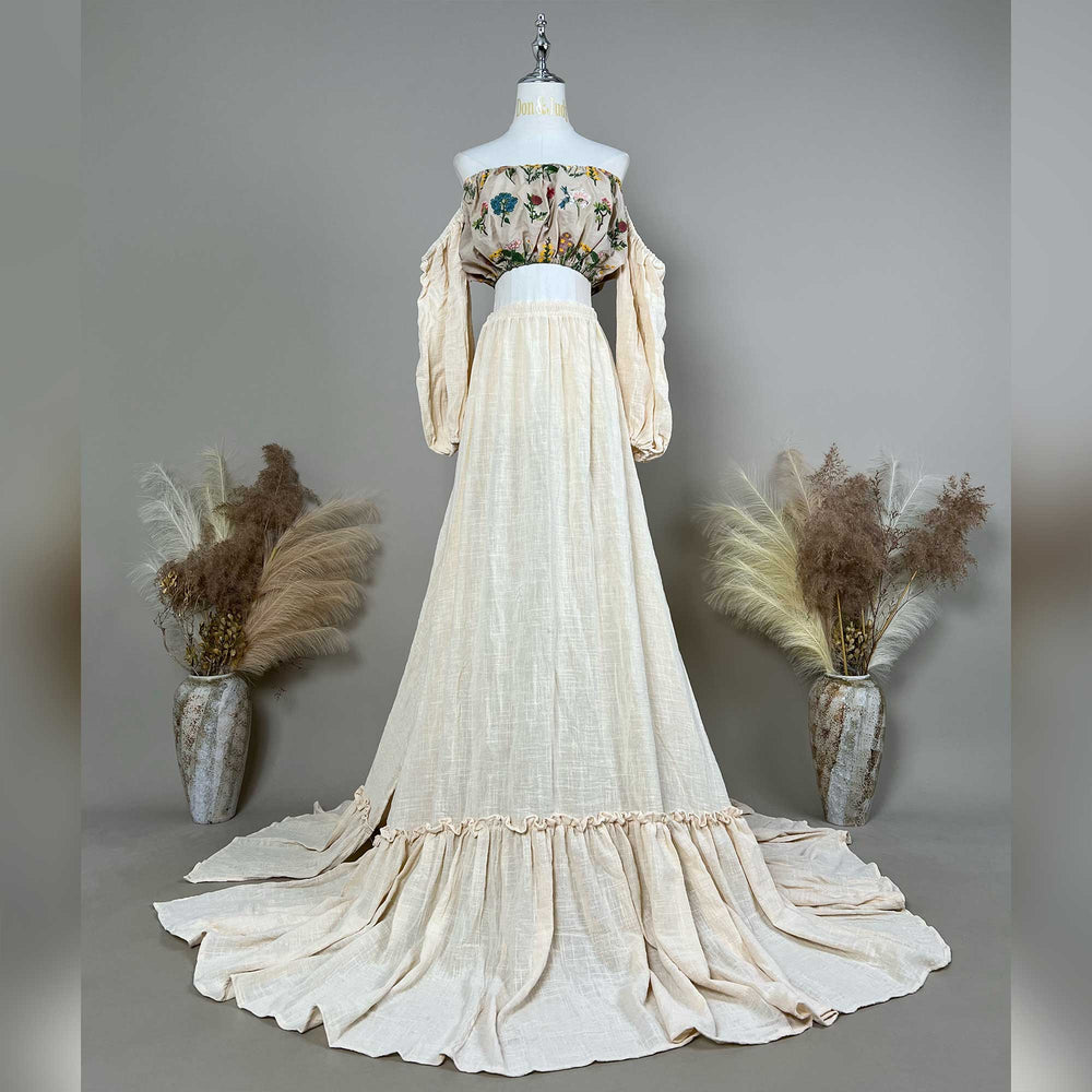 A mannequin displays a Freda beige boho embroidery floral two piece gown.