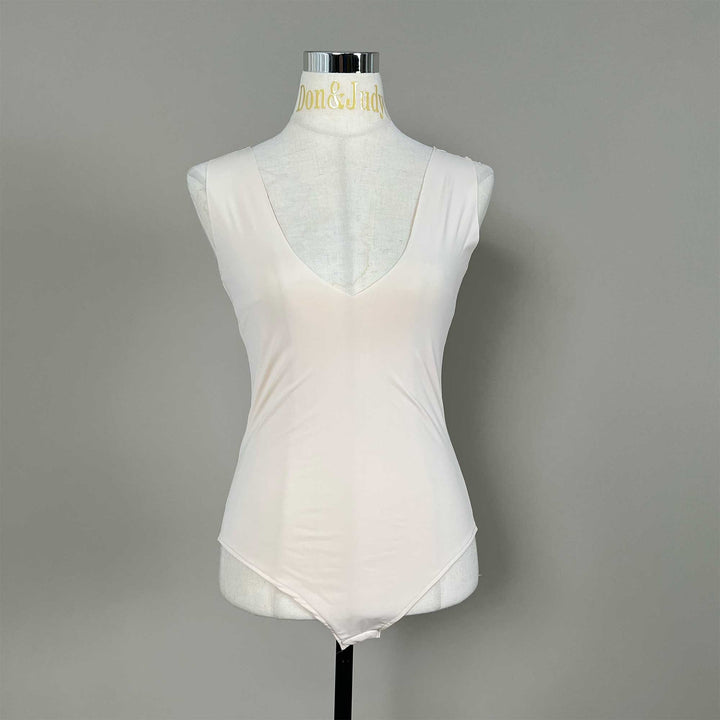A mannequin displays a Medusa skin sleeveless V-neck bodysuit with a high-cut hem.